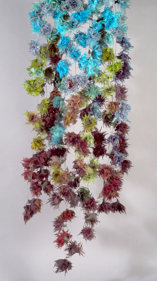 Yuh Okano. <em>Flower: Coming Events Cast Their Shadow Before</em>, 2010. Silk, partially felted with raw wool; hand-formed corsages. 71 × 20 in. (180 × 50 cm). Courtesy of the artist.