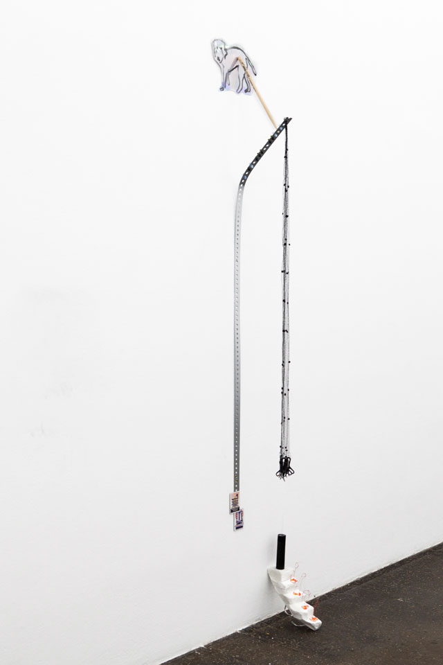 Sophie Jung. The Acknowledgement Problem, 2016. Performance / mixed media prop-sculpture (iridescent paper, tar paint, Pete Best drumstick (signed), ear plugs, fridge magnets, sock holders, egg shells, carrara marble, 3D printed penis, charcoal, mourning veil, aluminium off-cut). Photograph: Sophie Jung.