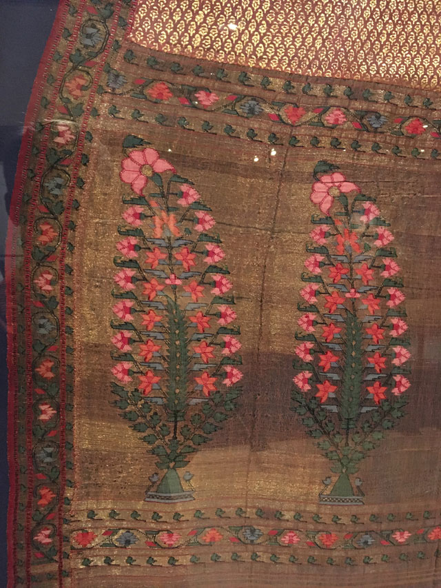 Kashmir shawl (detail), printed and brocaded gold and pink shawl, circa 1800. Block printing and weaving on silk. From The Whitworth’s collection. Photograph: Veronica Simpson.