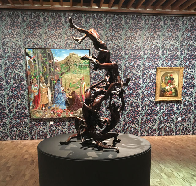 Nonet sculpture (Raqib Shaw) with The Adoration in the background. Installation view, the Whitworth Manchester, 2017. Photograph: Veronica Simpson.
