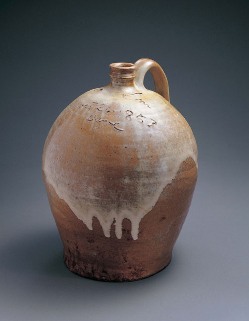Jug. Dave Drake (c1800–c1870). Lewis J. Miles Pottery, Edgefield County, South Carolina, 1853. Alkaline-glazed stoneware, 14 1/2 x 12 x 11 1/2 in. Collection American Folk Art Museum, New York. Gift of Sally and Paul Hawkins. Photograph: John Parnell, New York.